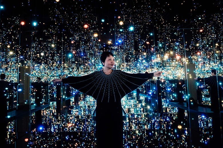 Yayoi Kusama's Infinity Mirrors exhibition curator Mika Yoshitake poses its the Souls of Millions of Light Years Away at the Hirshhorn Museum February 21, 2017 in Washington, DC. 