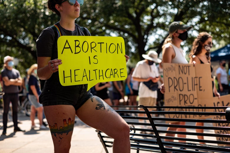 A woman carries a sign declaring abortion a part of health care at a rally at the Texas State Capitol on September 11, 2021 in Austin, Texas.