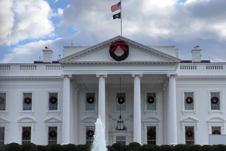 Holiday wreaths adorn the windows of the White House.