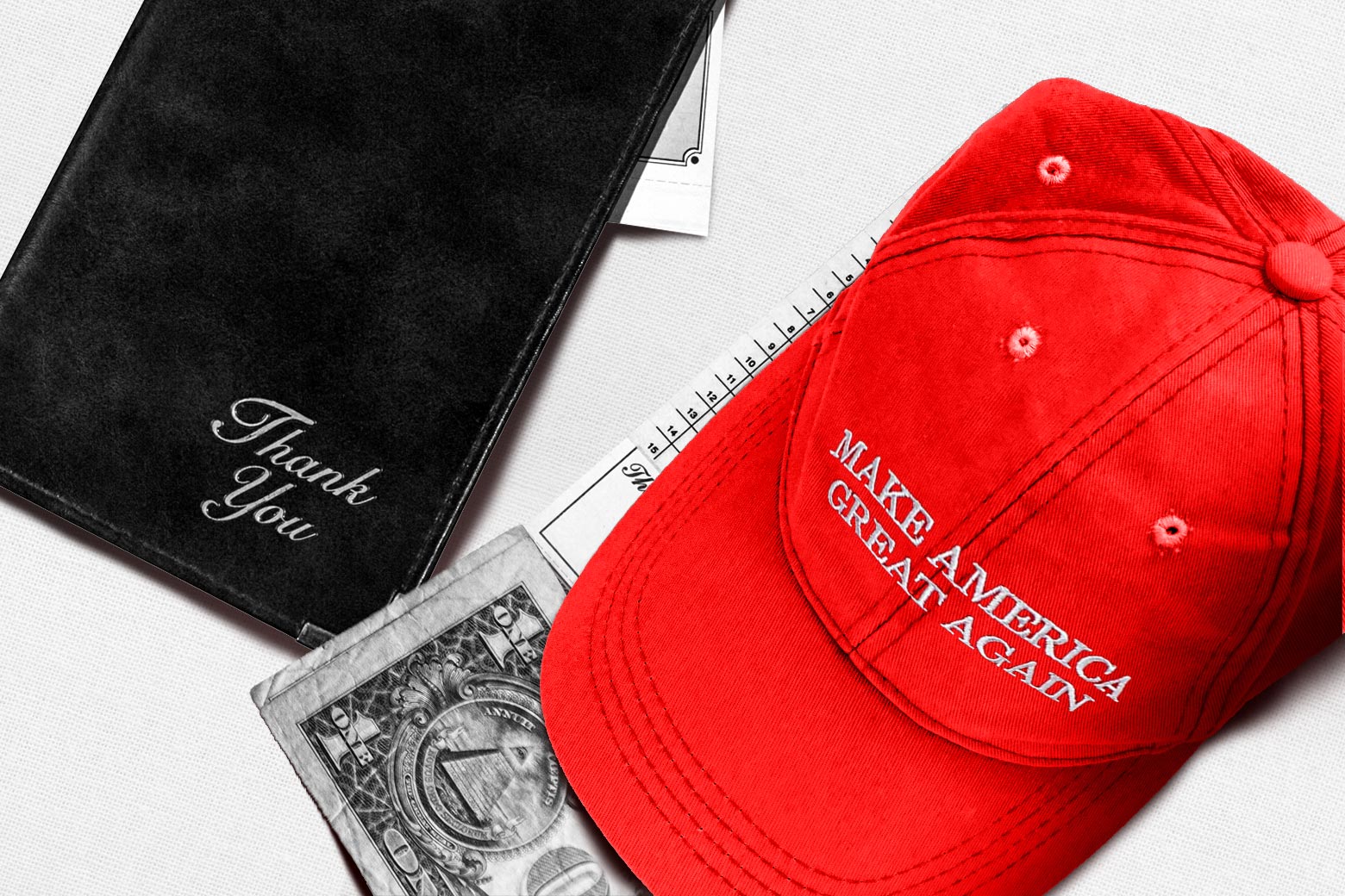 A red MAGA hat sitting on top of a restaurant bill and a one dollar tip next to a black leather bill presenter on a white tablecloth