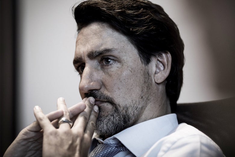 Trudeau, sporting a light beard, leans his head against his own steepled fingers.
