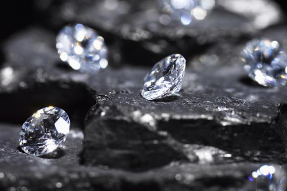 Small diamonds on layered coal.