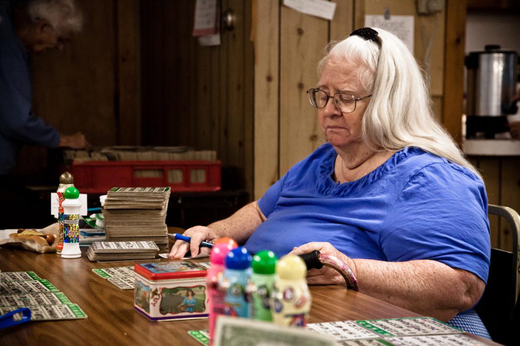 Woman with Bingo Card Stack