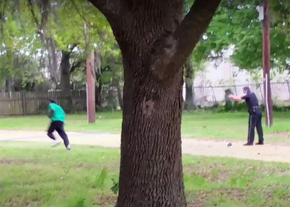 Police officer Michael Slager (right) is seen shooting Walter Scott in the back in this still image from video in North Charleston, South Carolina on April 4, 2015.