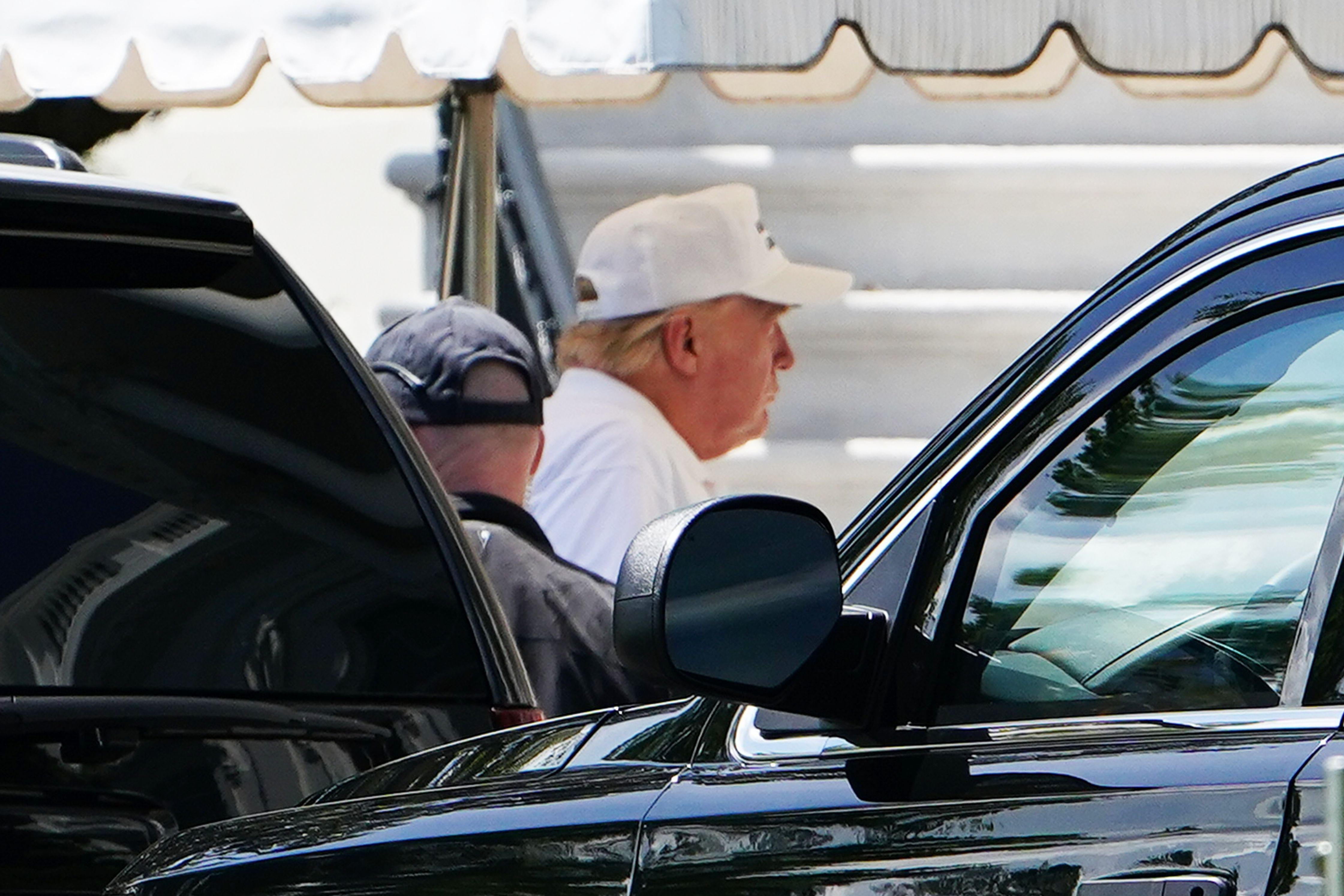 President Donald Trump walks from a SUV upon return to the White House in Washington, D.C. on May 23, 2020.