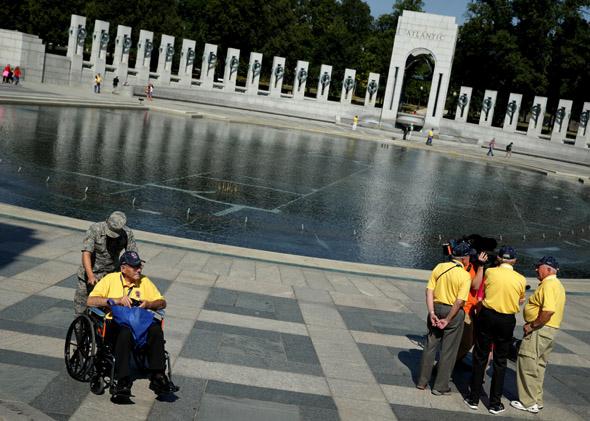 Military veterans visit the World War II Memorial as some of them are interviewed by news media during a government shutdown October 1, 2013 in Washington, DC. 