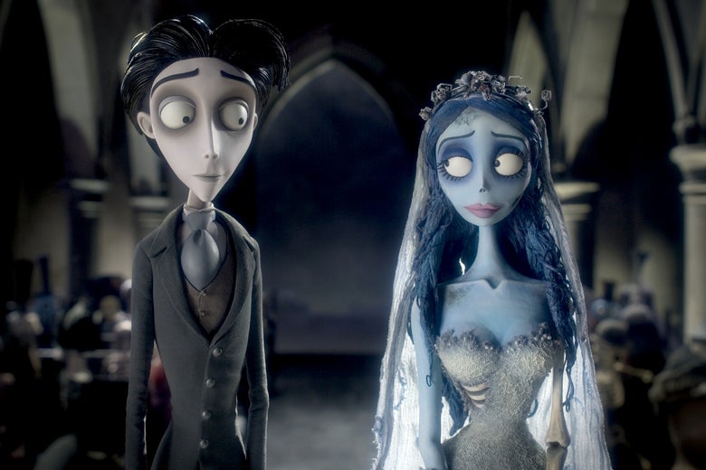 An animated skinny pale man with dark hair and hollow dark-circled eyes stands at the altar with an animated female blue-skinned corpse in a wedding dress.