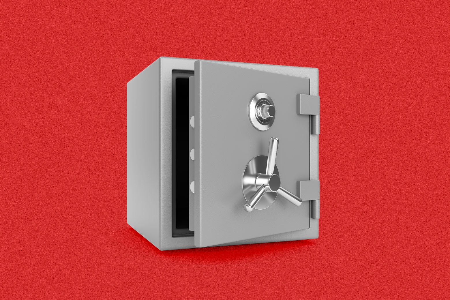 A slightly ajar grey box safe with two knobs on a red background. 