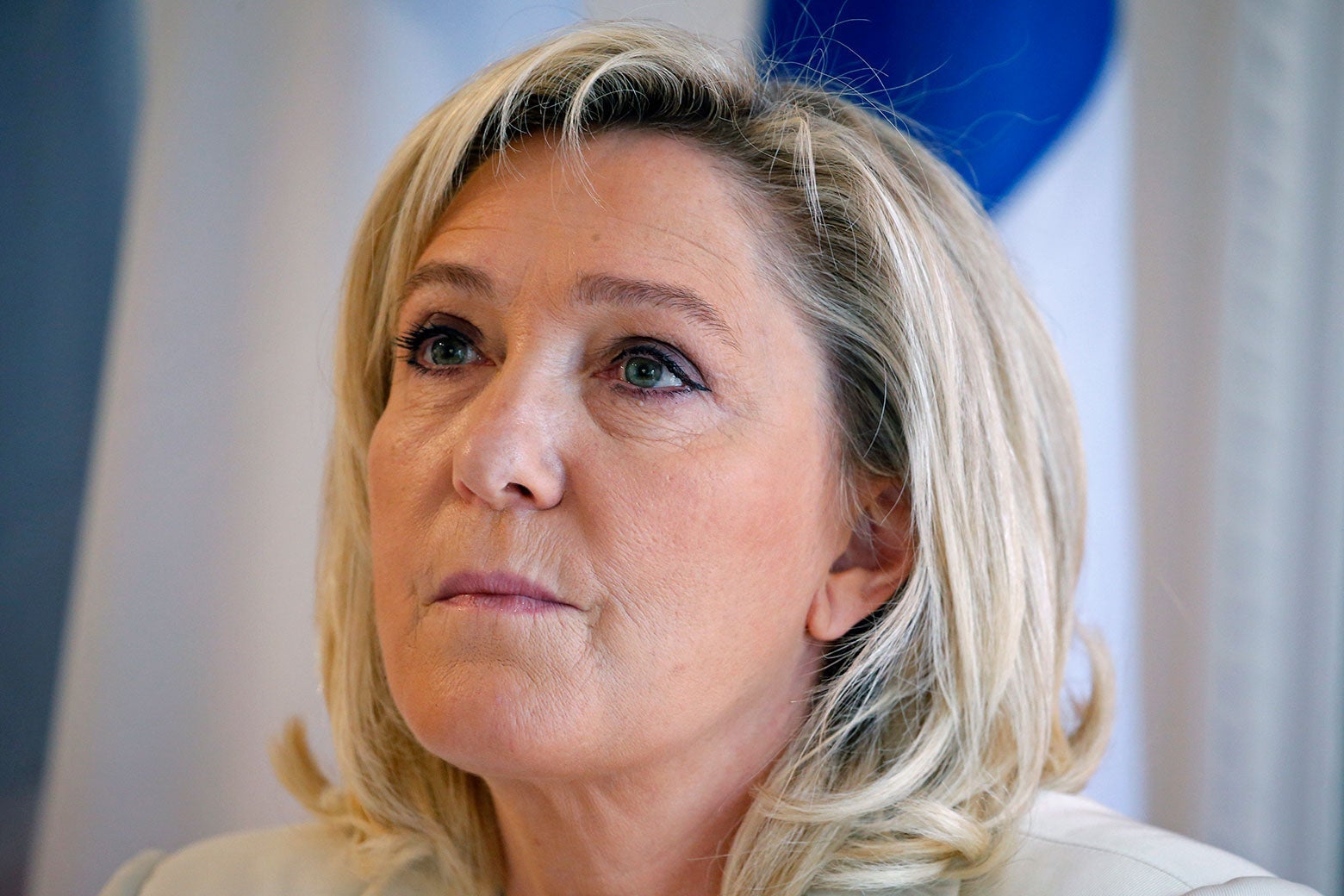 Close-up on Le Pen looking upward