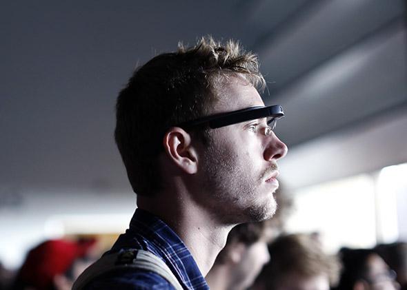 An attendee wears a Google Glass