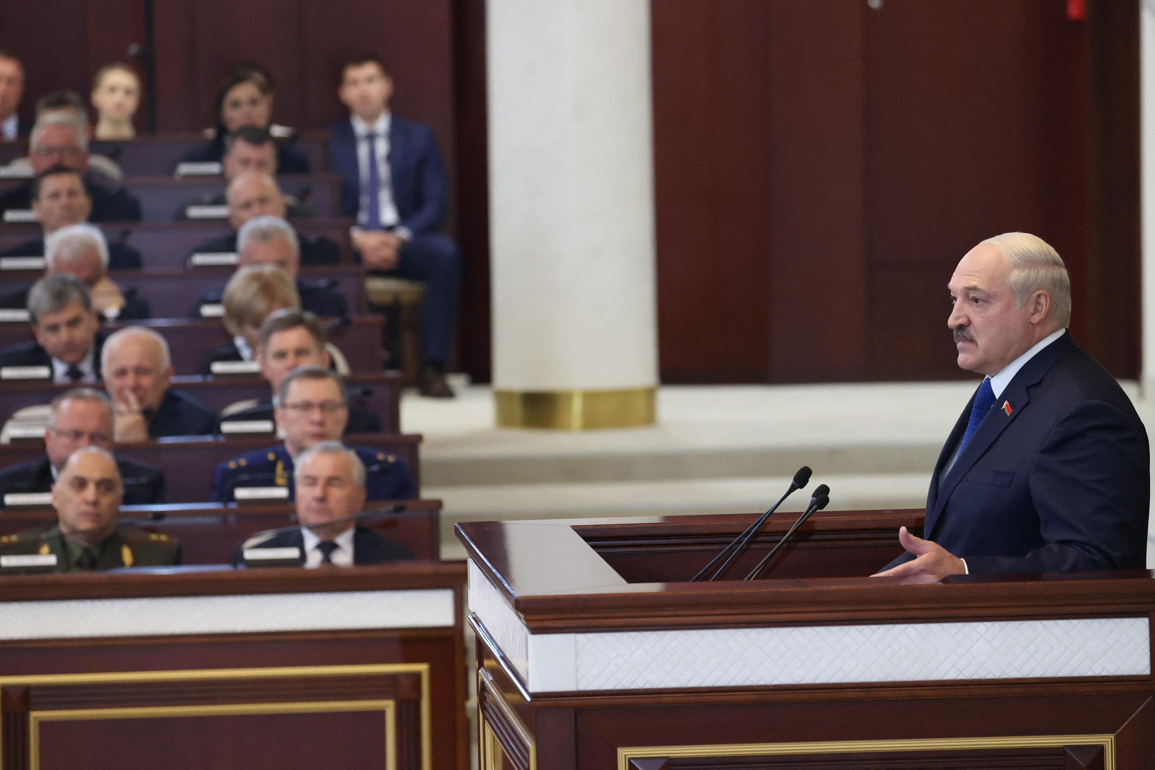 Belarusian President Alexander Lukashenko speaks from a podium in parliament.
