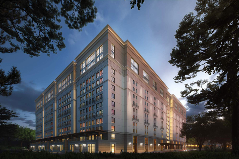 Rendering of the exterior of Munger Hall at nighttime. It's a large, block-sized dormitory.