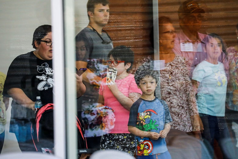 Children seen through a glass window