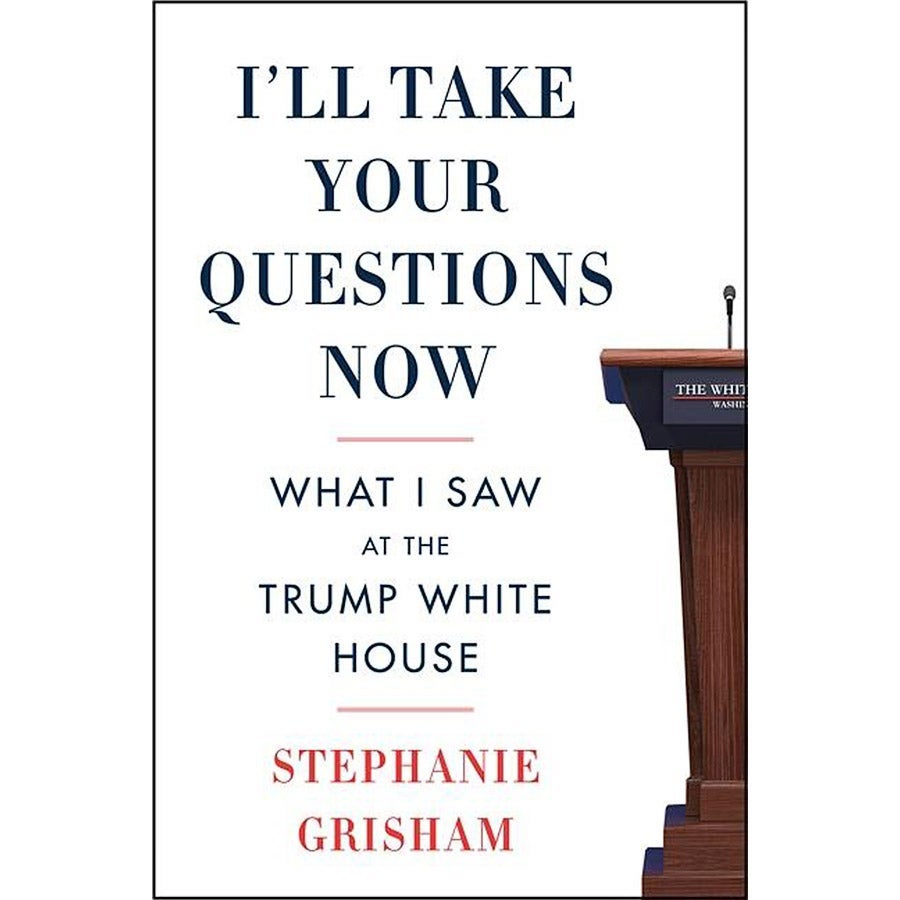 The book's cover reads "I'll Take Your Questions Now: What I Saw at the White House" in red, white, and blue, with half a press podium at the side