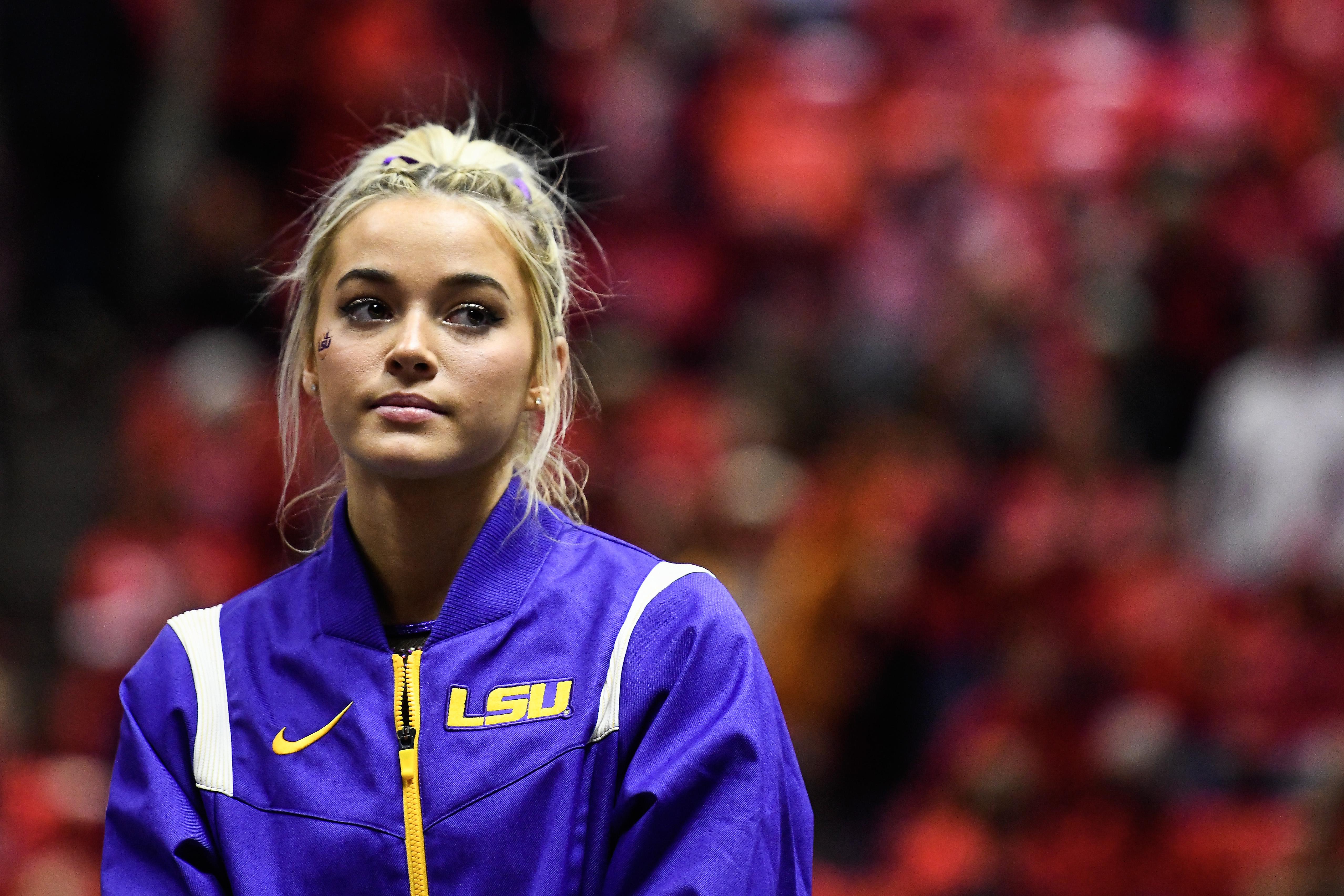 Dunne in her LSU warmup jacket giving a side-eye