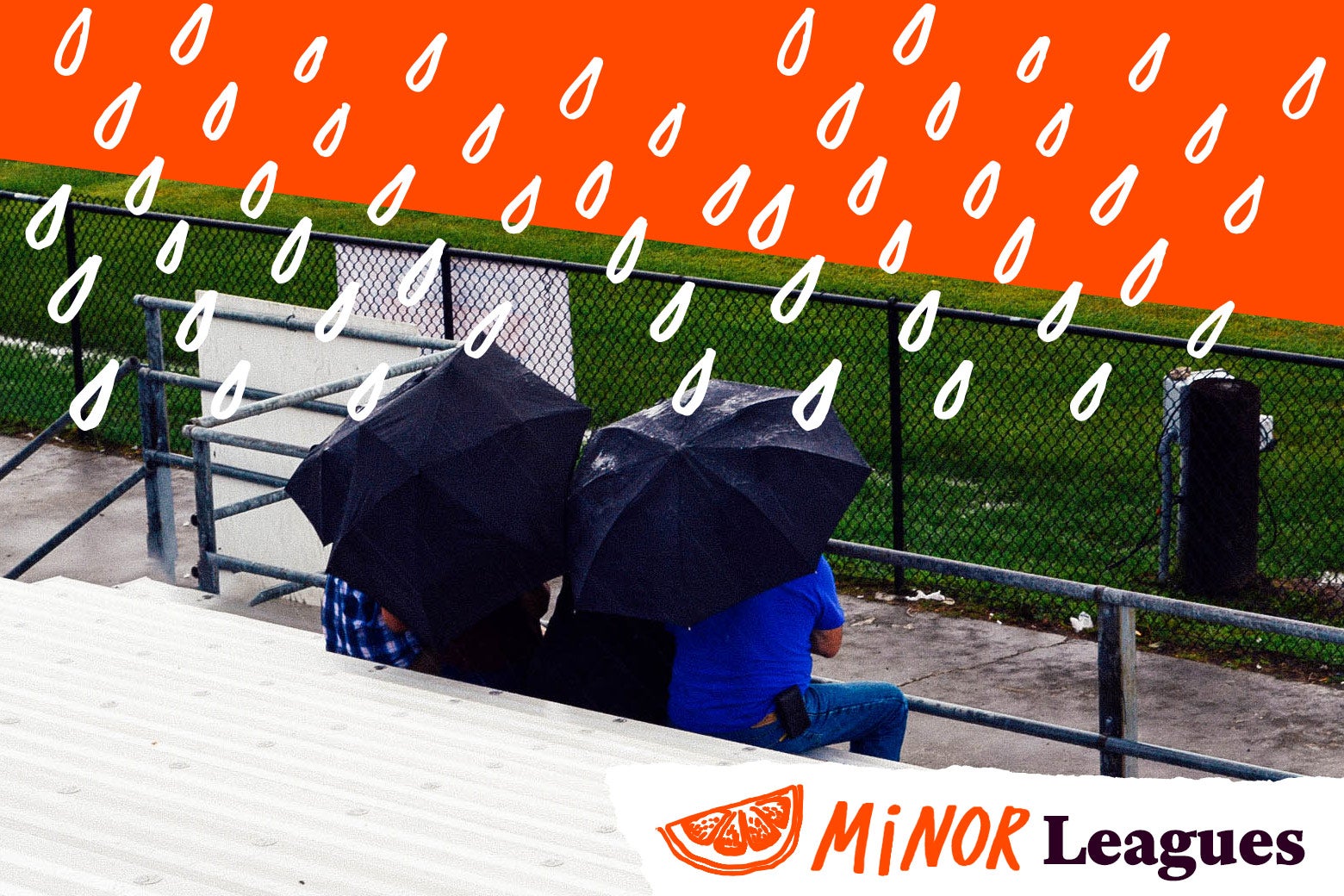 Parents sitting in the rain watching youth sports.