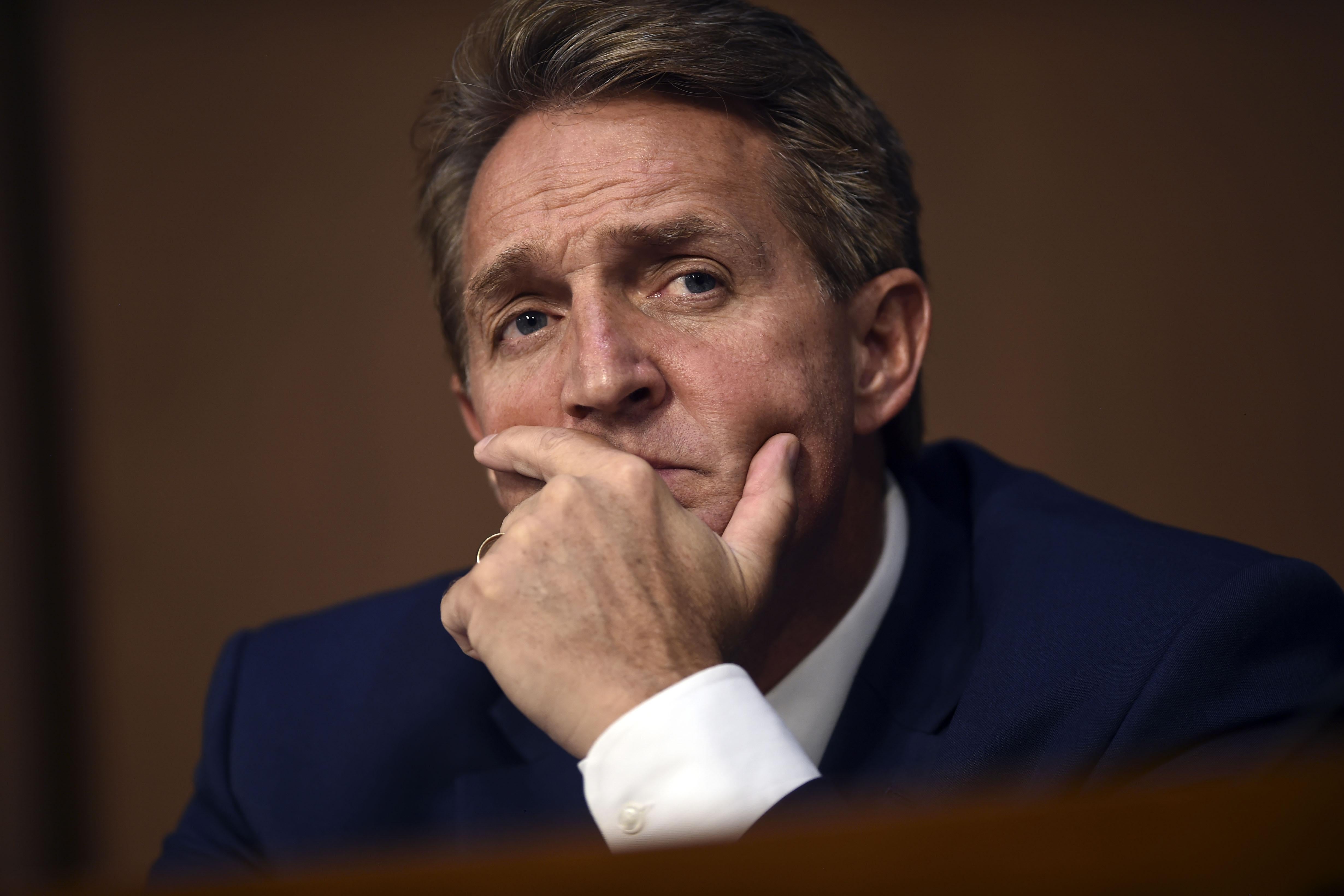 Sen. Jeff Flake listens on Tuesday during day one of Brett Kavanaugh's confirmation hearing to be on the U.S. Supreme Court.