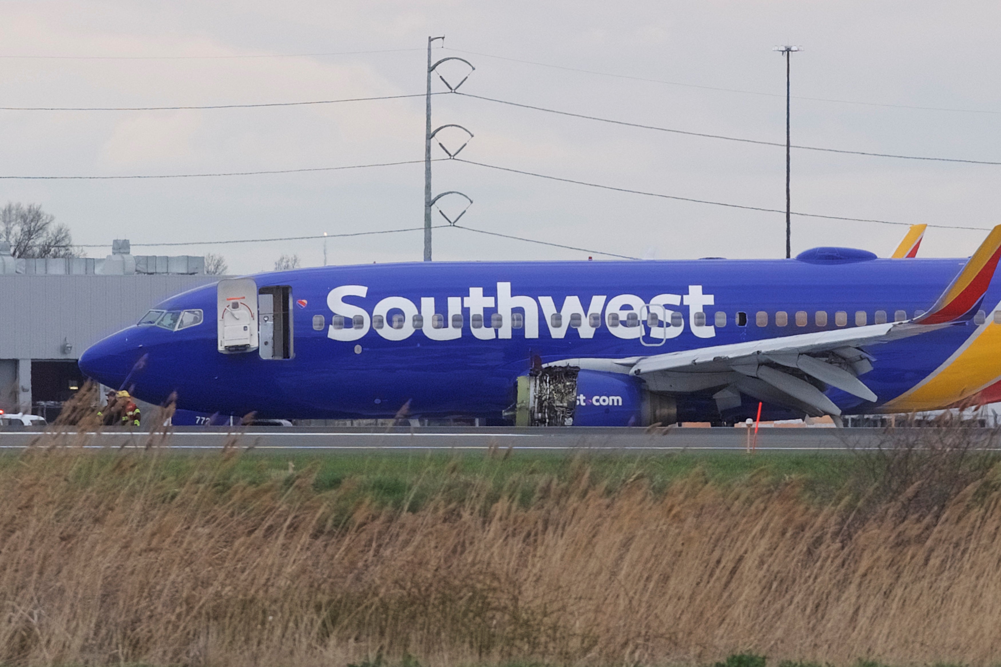 The Southwest Airlines plane that made an emergency landing in Philadelphia Tuesday. A window on its left side is broken out.