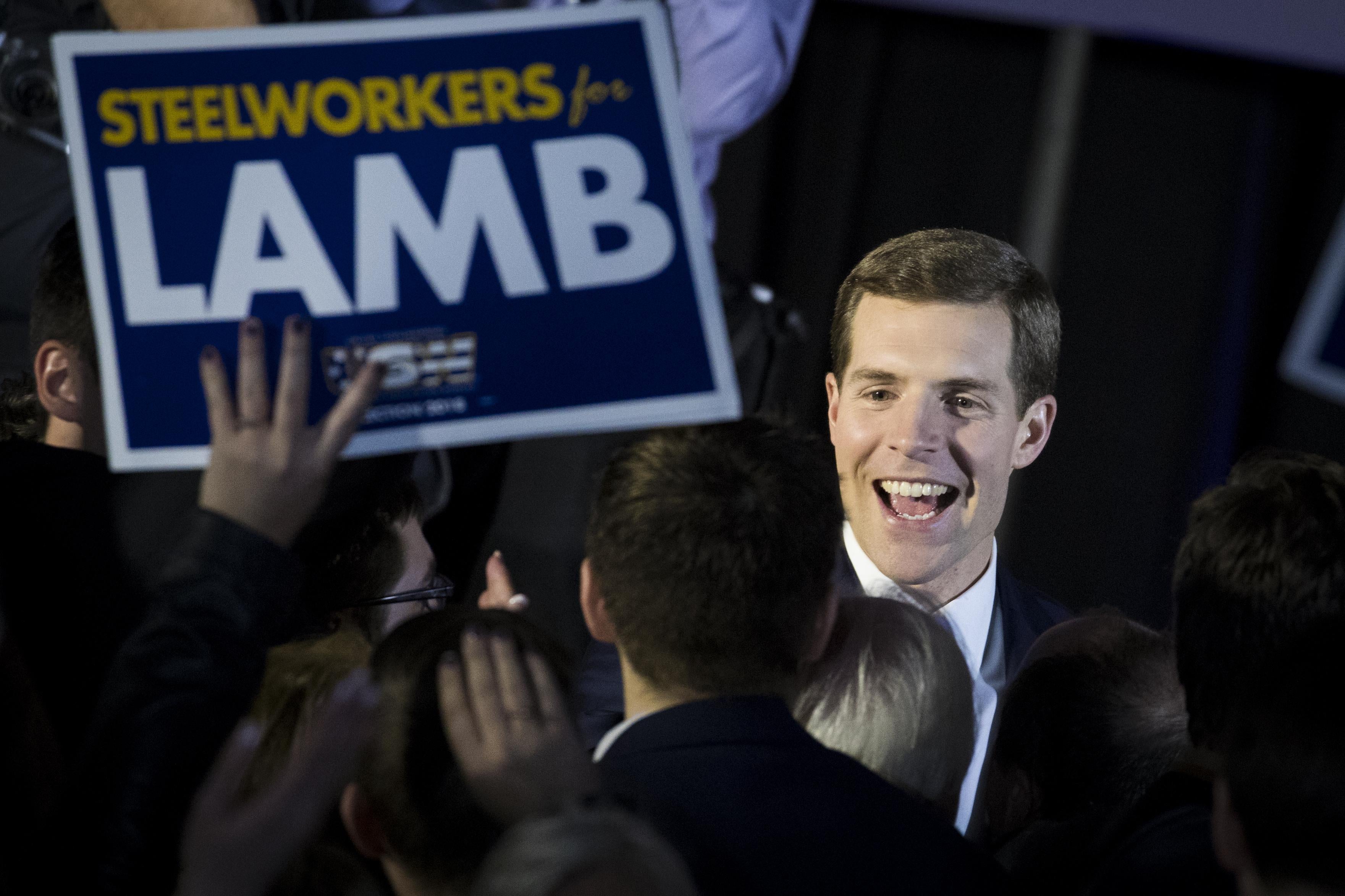 Conor Lamb greets supporters at an election night rally in March.