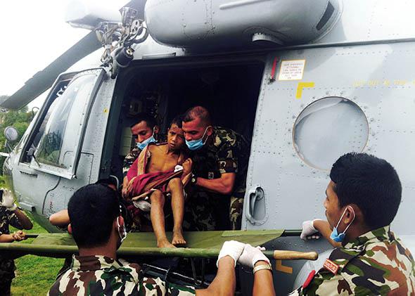A boy being helicoptered to a hospital, Nepal, April 2015.