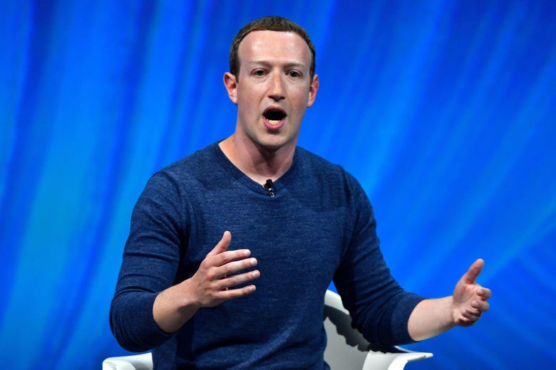Mark Zuckerberg gestures while speaking at an event.