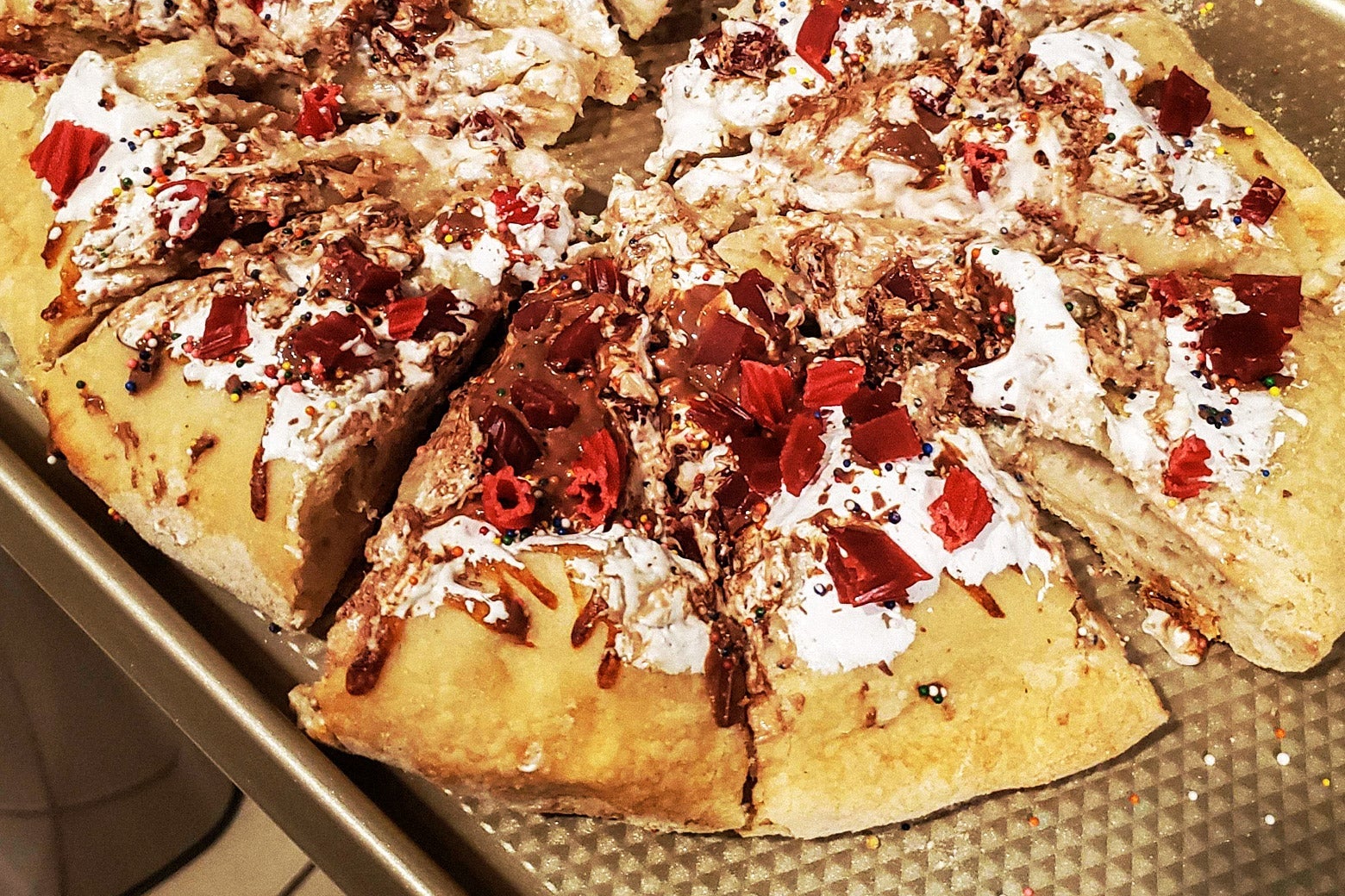 The dessert pizza after it was cut into slices.
