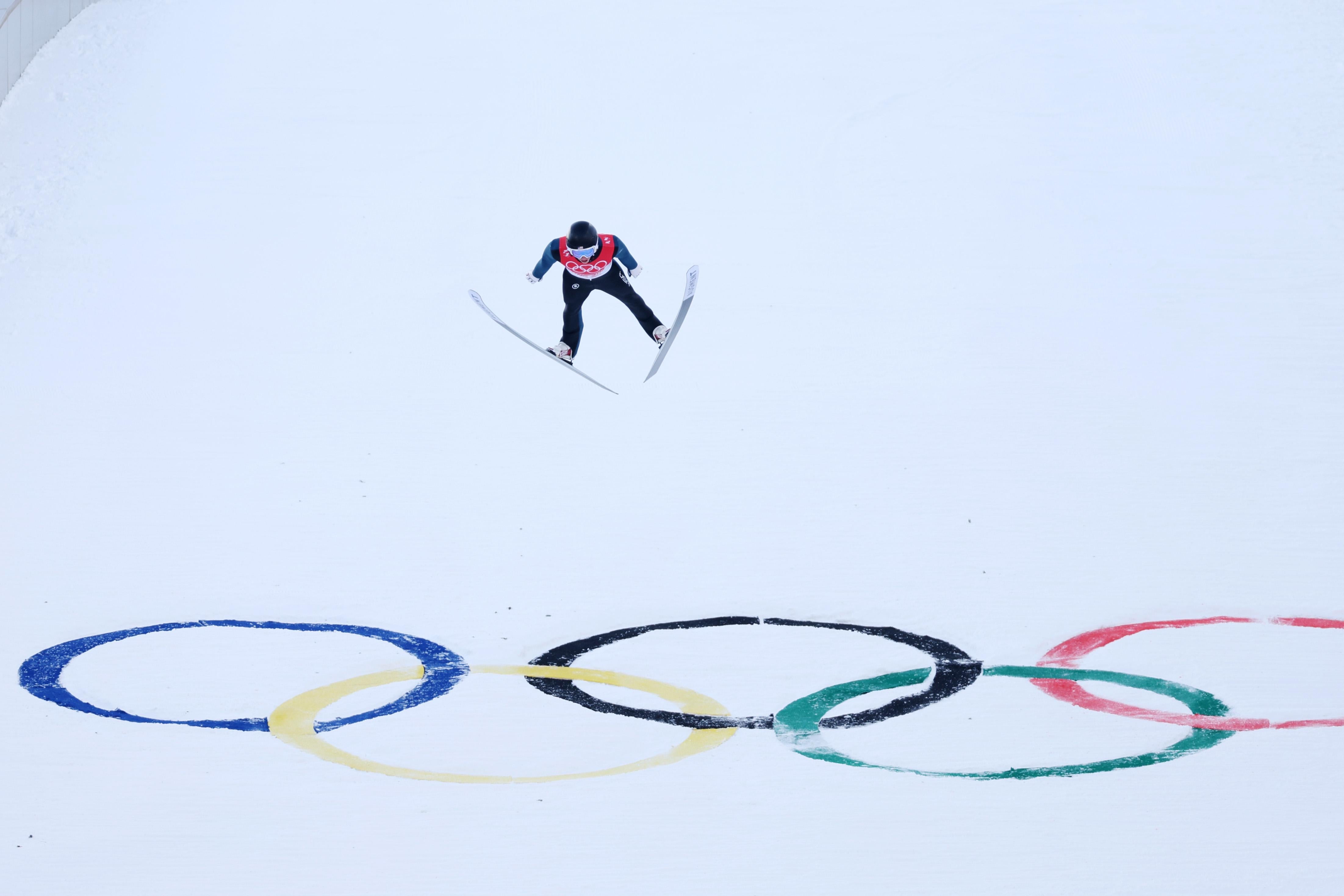 Jared Shumate of Team United States mid-air during the ski jump.