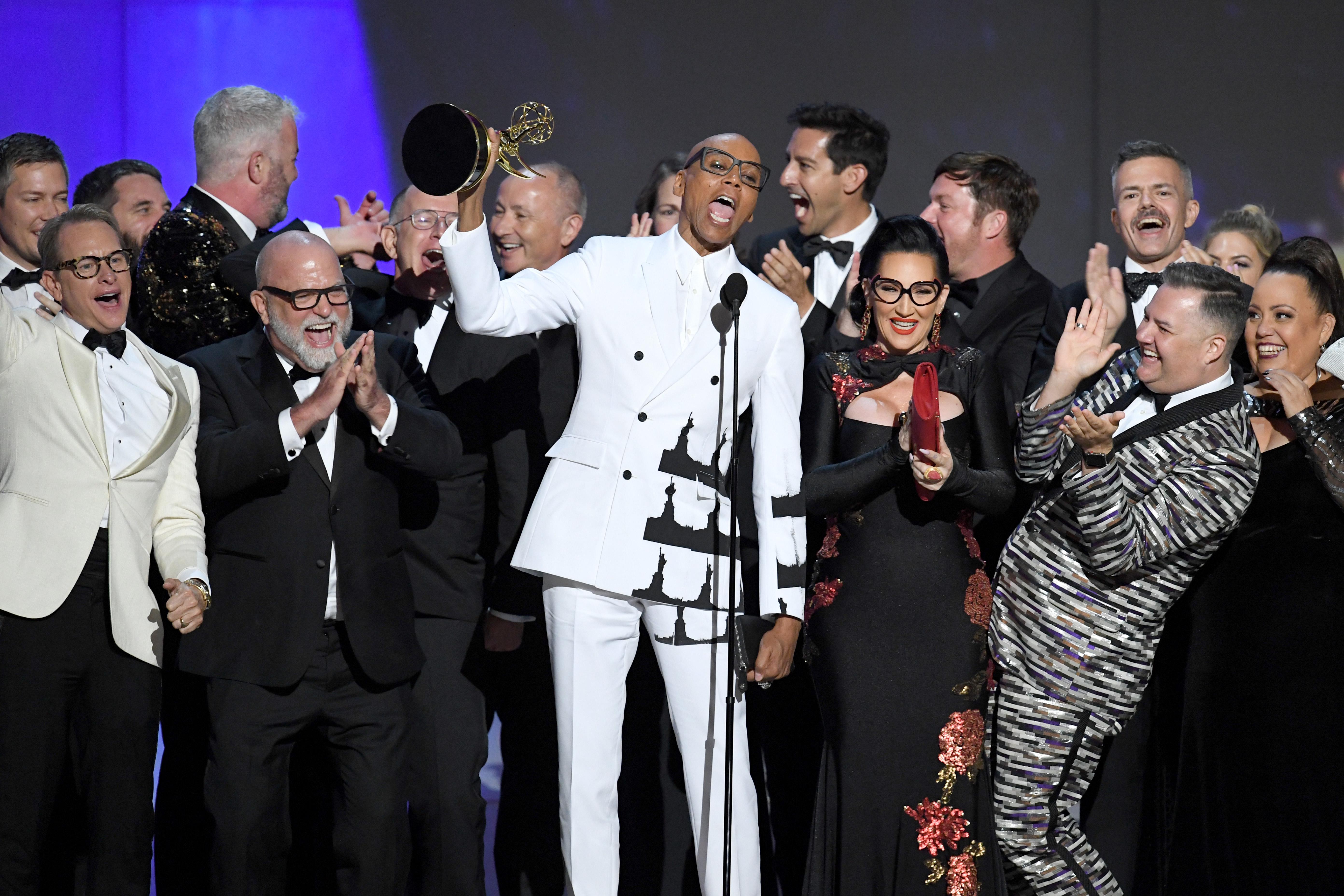 RuPaul and cast and crew onstage accepting the award.