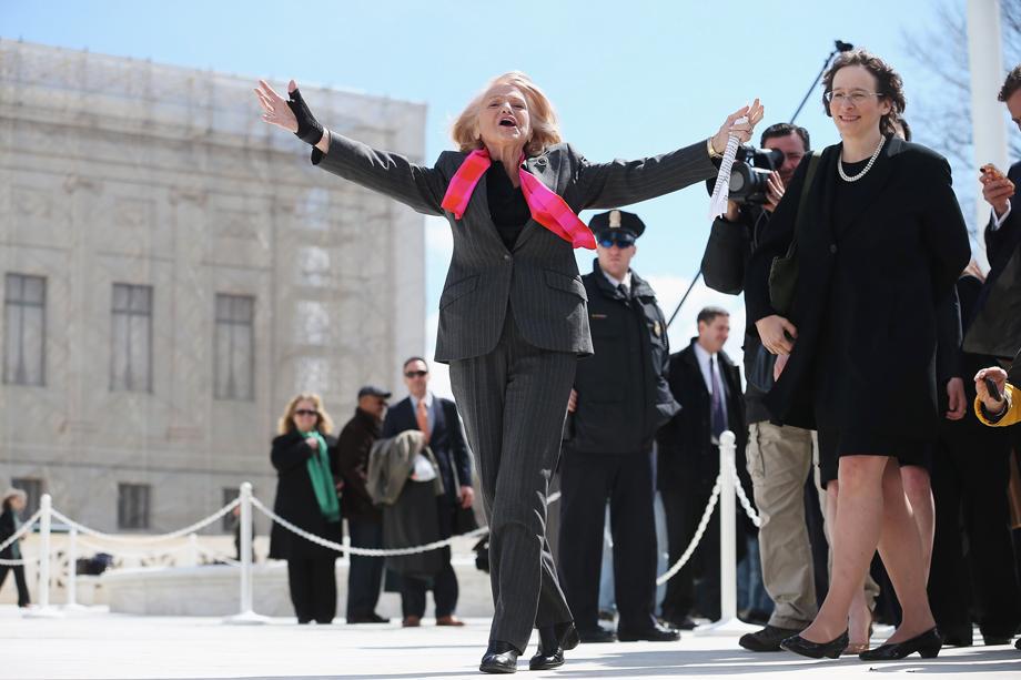 Edith Windsor, the 83-year-old plaintiff in the case challenging the Defense of Marriage Act, acknowledges her supporters as she leaves the Supreme Court, March 27, 2013 in Washington, D.C.