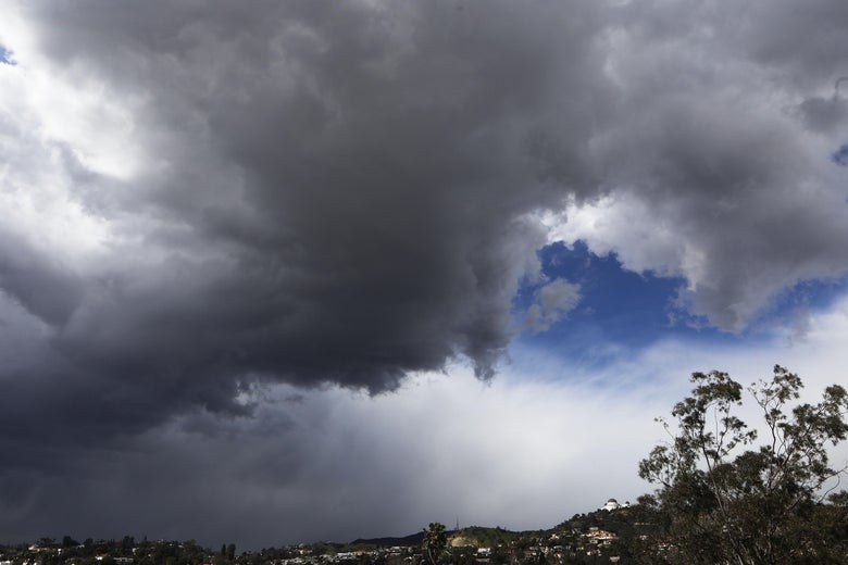 LOS ANGELES, CA - FEBRUARY 21:  A storm cloud looms over hills during an unusually cold winter storm system on February 21, 2019 in Los Angeles, California. Some parts of Los Angeles County received a brief dusting of snow during the storm which carried a wintry mix.  (Photo by Mario Tama/Getty Images)