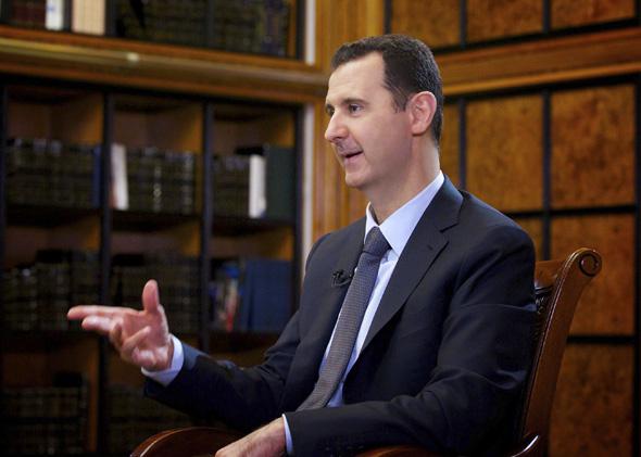 Syria's President Bashar al-Assad speaks during an interview with Russian state television RU24 in Damascus.