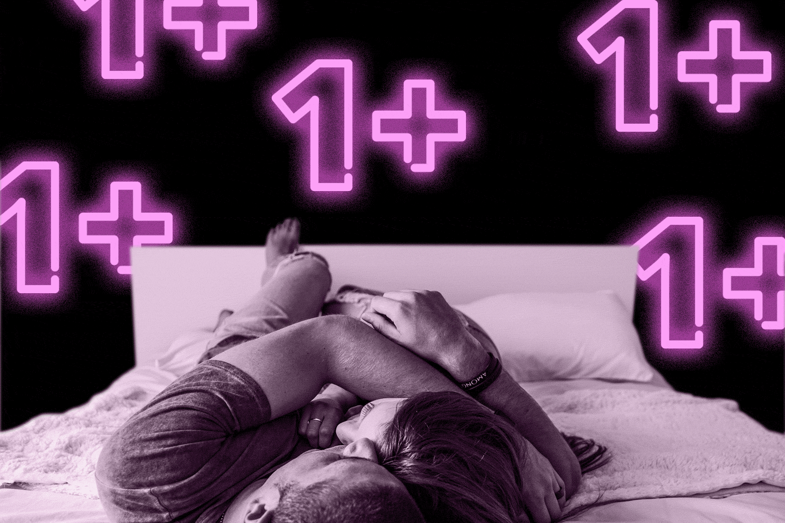 A man and woman cuddle in bed. There are neon 1+ symbols behind them.