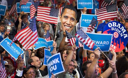 A DNC attendee waves an Obama-shaped sign as the President speaks.