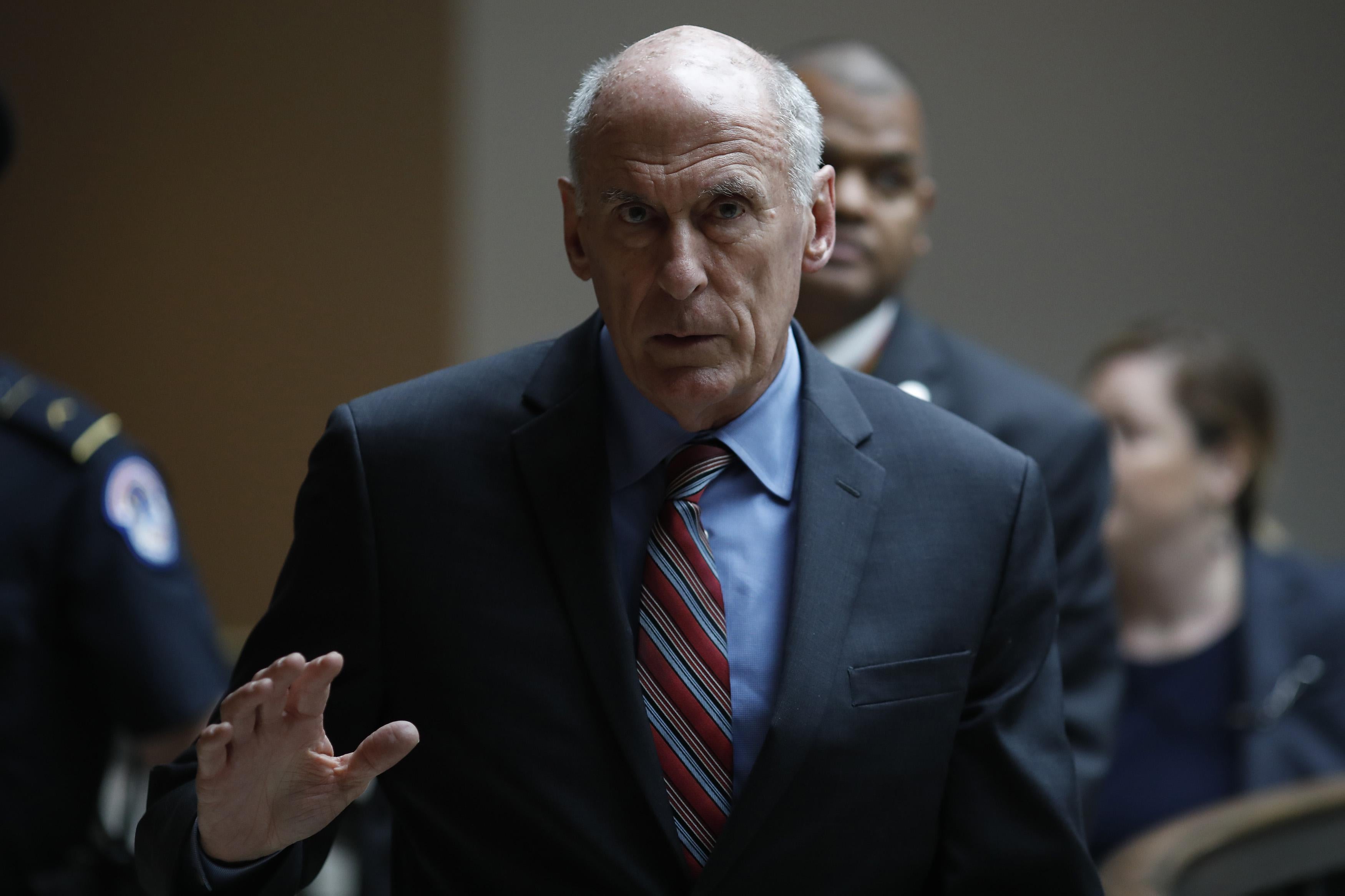 Director of National Intelligence Dan Coats departs a Capitol Hill briefing on election security measures in May. 