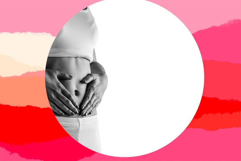 A woman standing with both hands placed on her flat exposed midriff