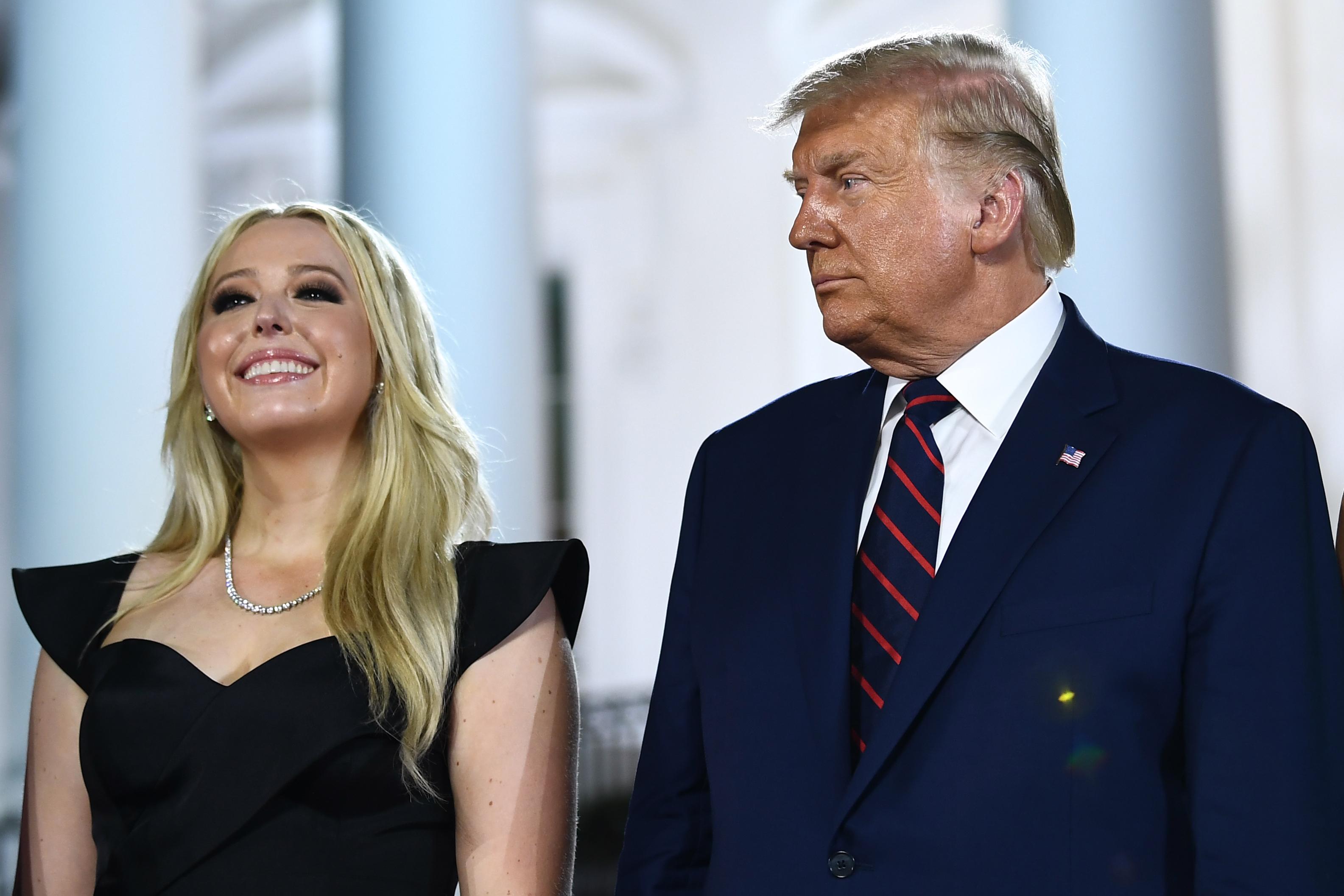 US President Donald Trump stands with daughter Tiffany Trump after he delivered his acceptance speech for the Republican Party nomination for reelection during the final day of the Republican National Convention at the South Lawn of the White House in Washington, DC on August 27, 2020. (Photo by Brendan Smialowski / AFP) (Photo by BRENDAN SMIALOWSKI/AFP via Getty Images)