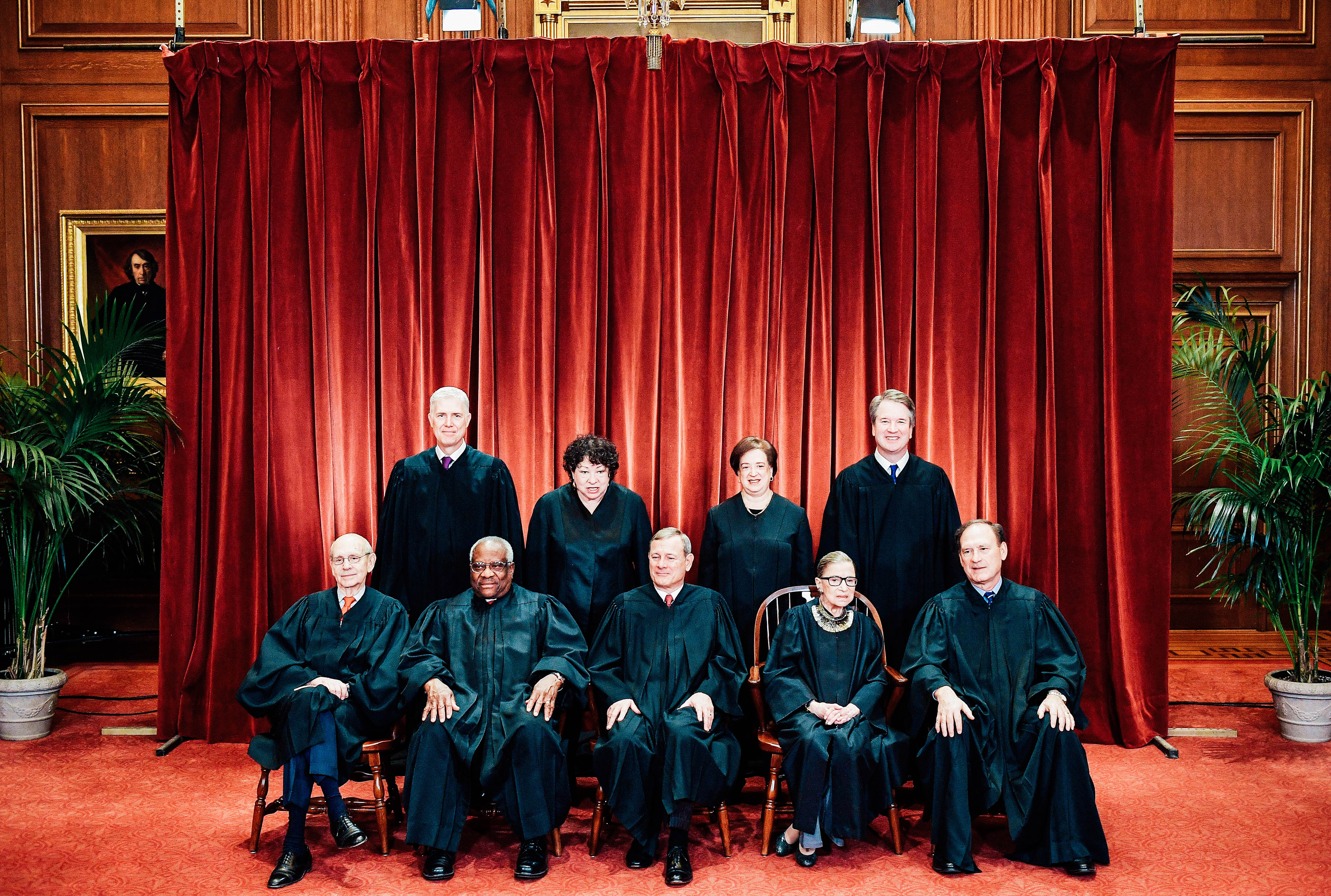 Justices of the Supreme Court pose for their official photo.