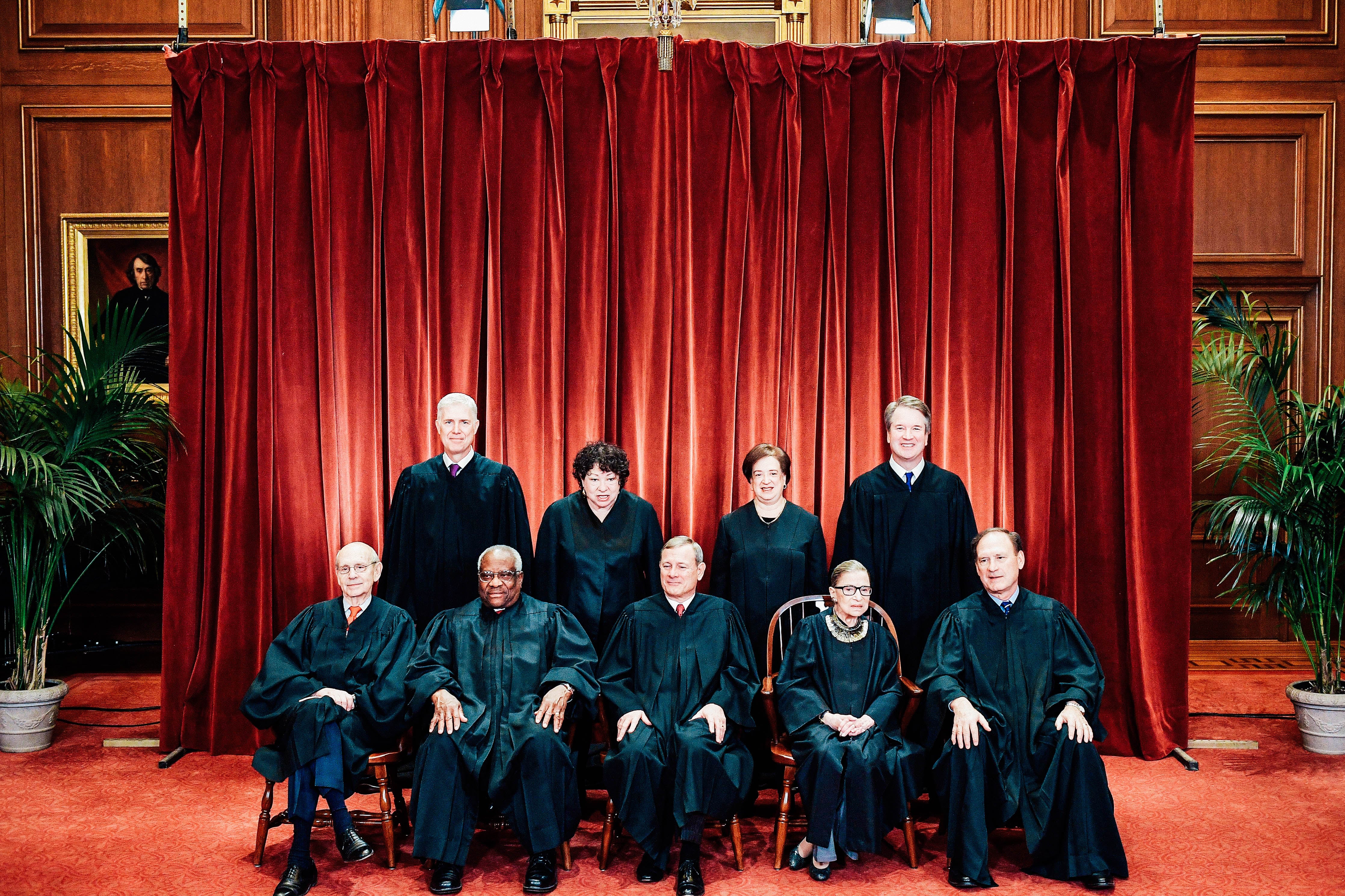 Justices of the Supreme Court pose for their official photo.