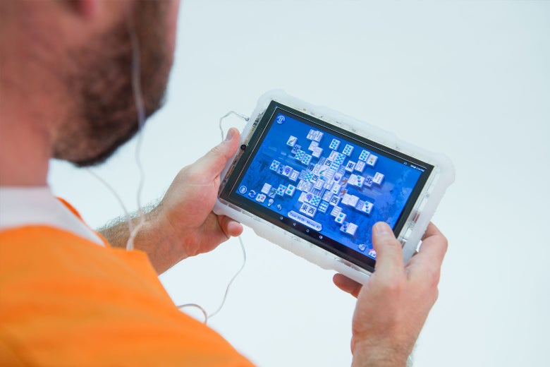 An inmate uses a Global Tel Link tablet.