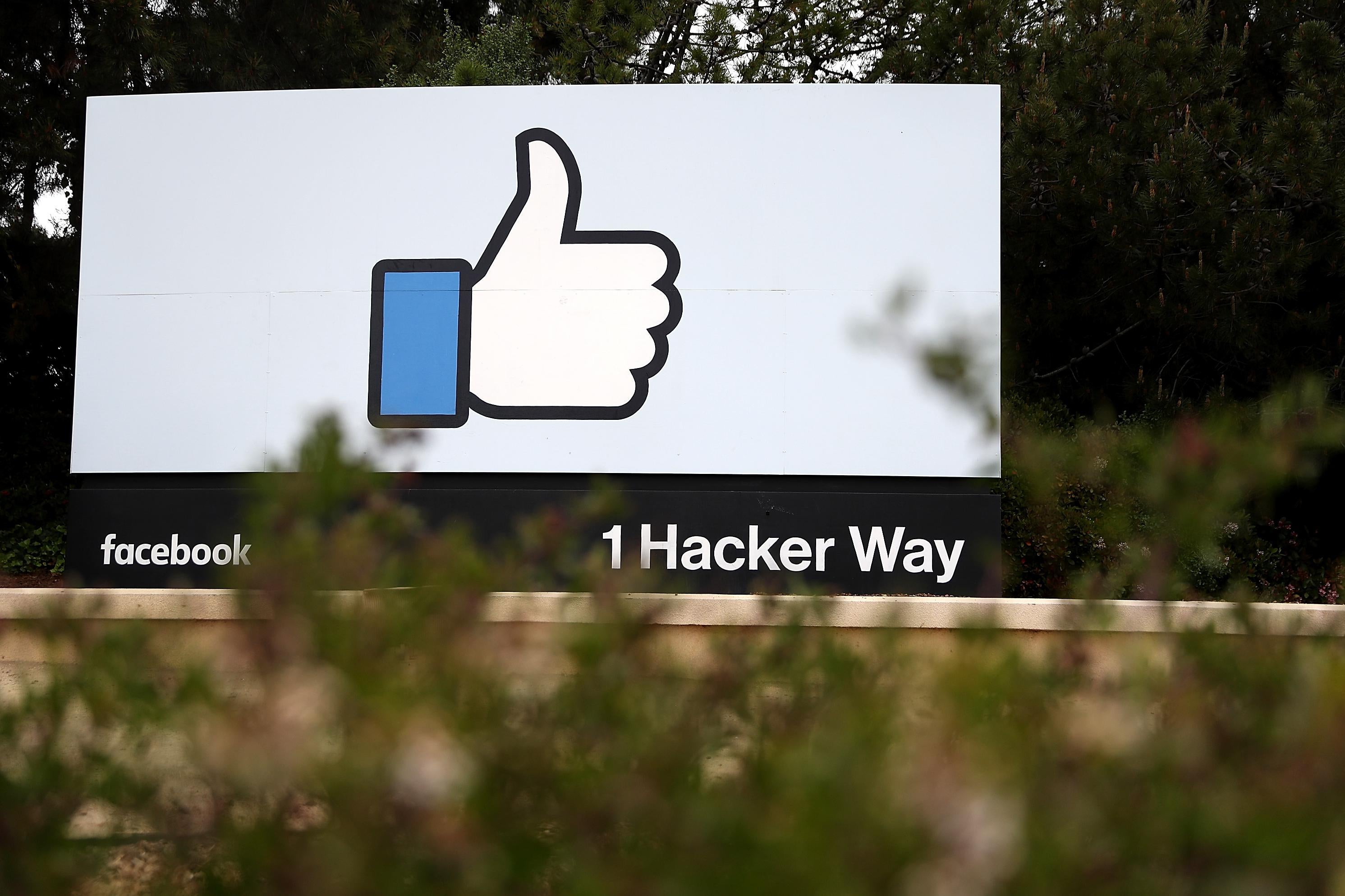 A sign outside Facebook's Menlo Park, California, headquarters depicting the thumbs-up like icon.
