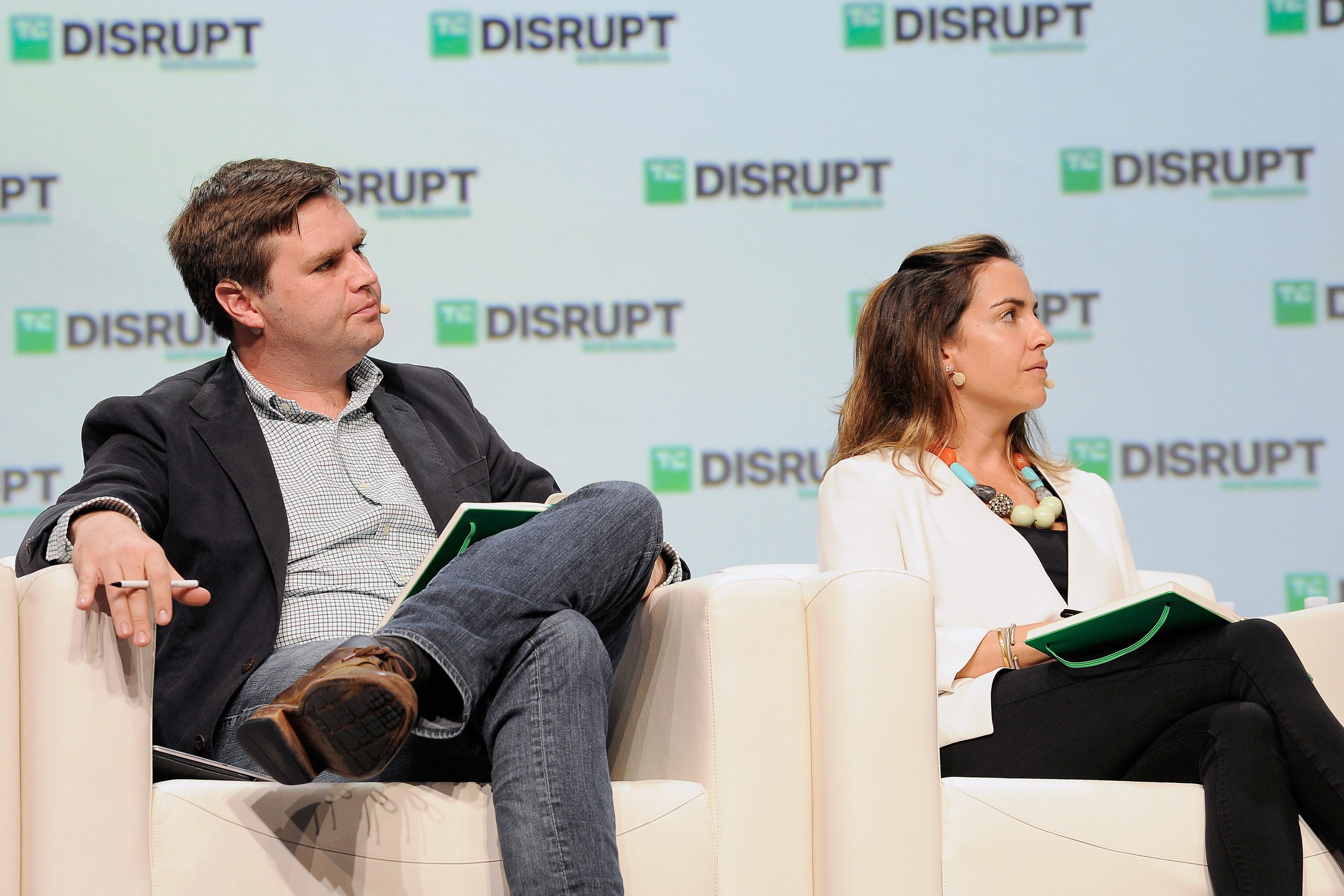 J.D. Vance sits in a white easy chair onstage at a tech event.