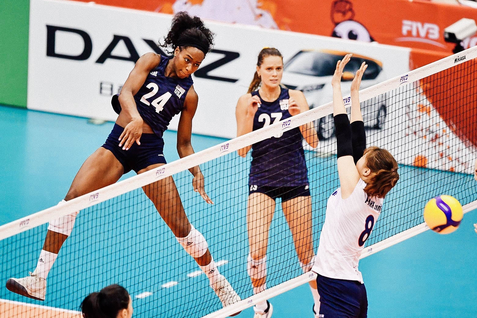 Ogbogu in midair at the net