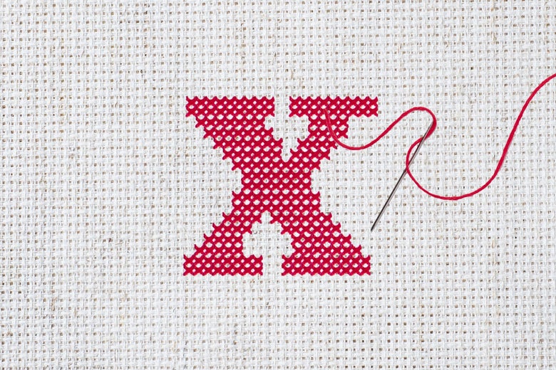 A cross-stitched red X.