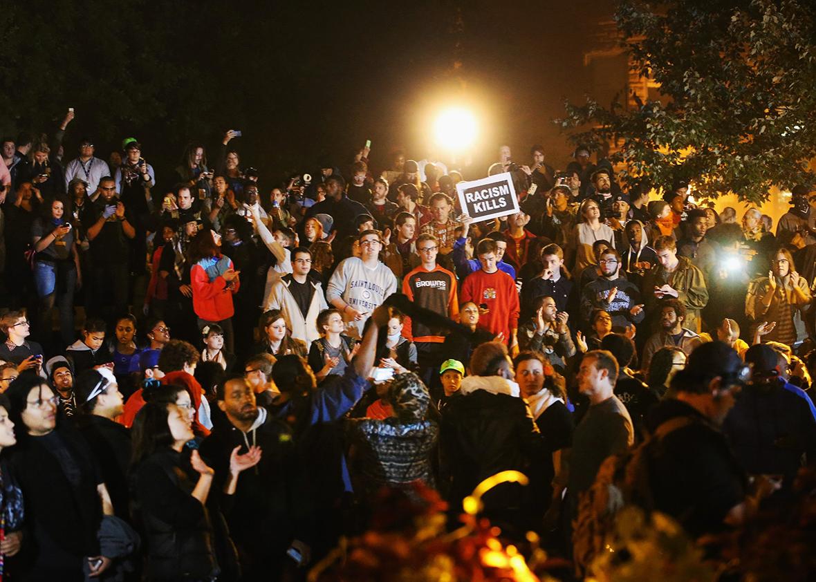 Demonstrators listen to speakers during a rally on the campus of Saint Louis University on October 13, 2014 in St Louis, Missouri. 