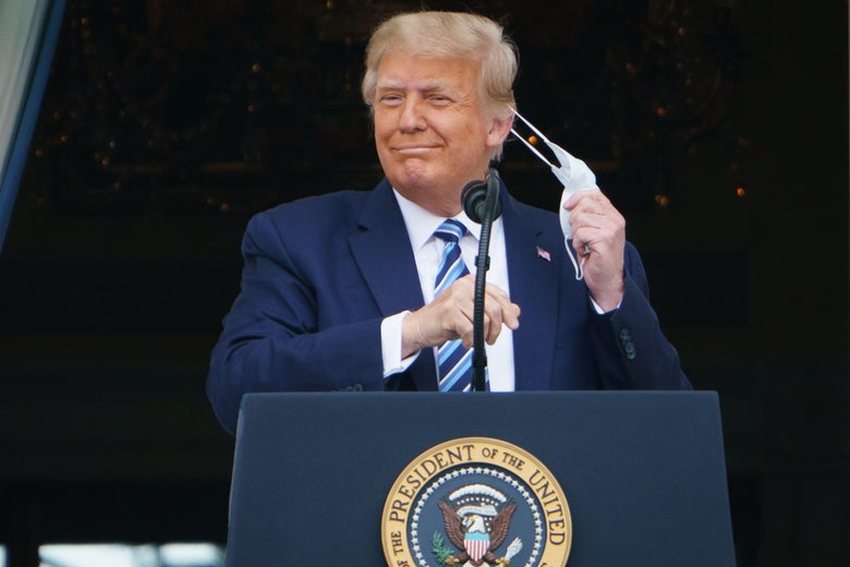 President Donald Trump takes his mask off before speaking from the South Portico of the White House in Washington, D.C. during a rally on October 10, 2020. 