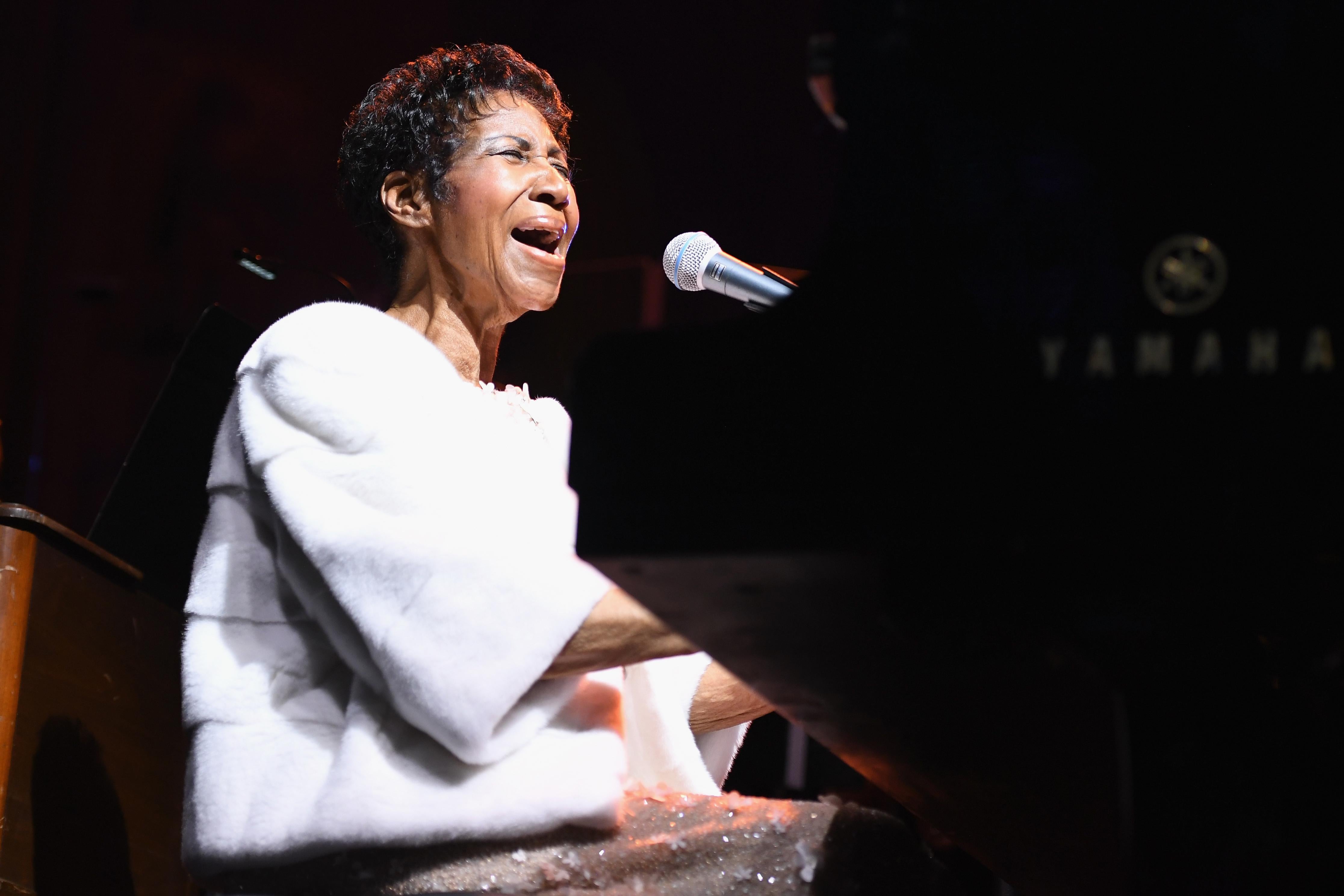 Aretha Franklin performs onstage.