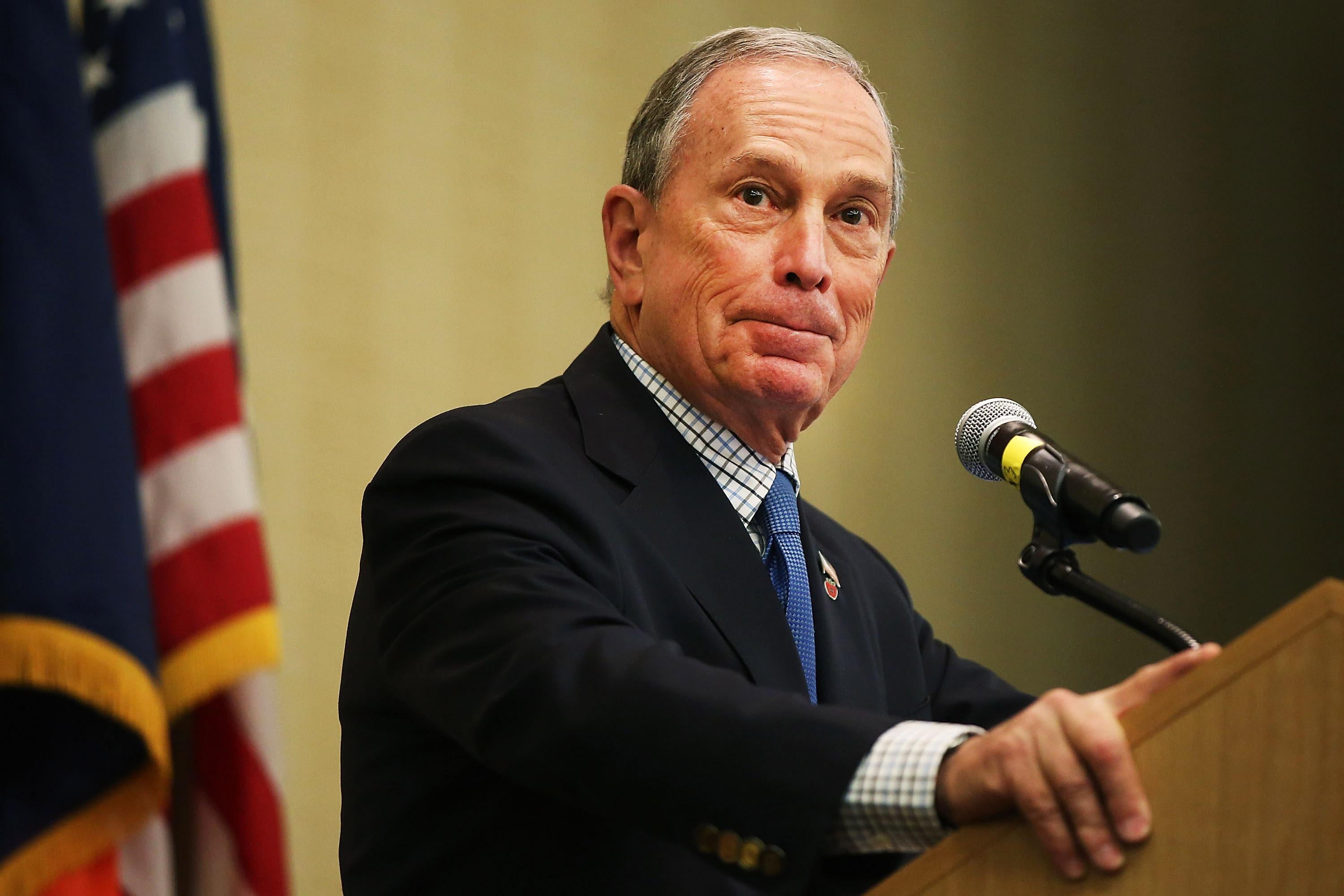 Michael Bloomberg at a podium.