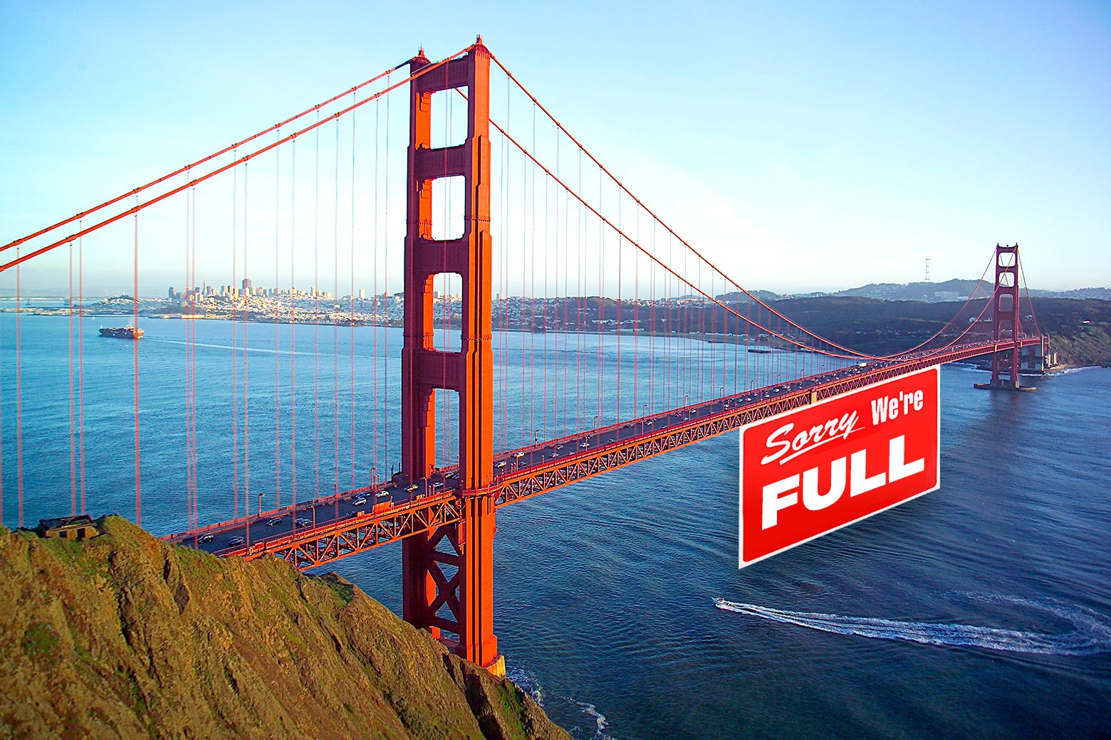The Golden Gate Bridge with a "Sorry, We're FULL" sign under it.