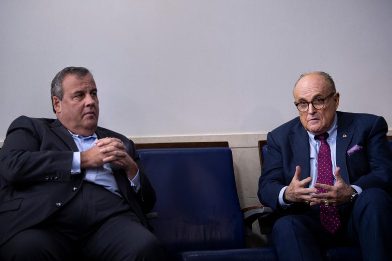Former New Jersey Governor Chris Christie listens while former New York City Mayor Rudy Giuliani speaks during a briefing at the White House September 27, 2020, in Washington, D.C.