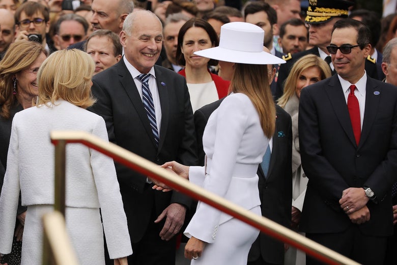 John Kelly greets Melania Trump at a White House event.